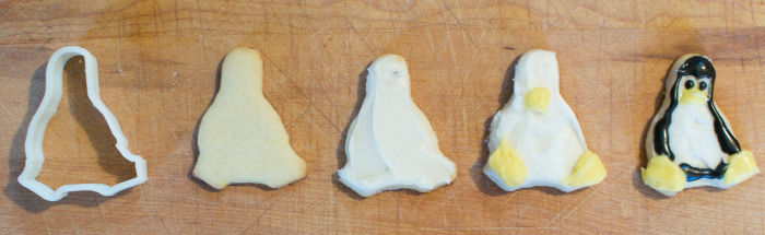 Tux (penguin) cookies, and a cookie cutter